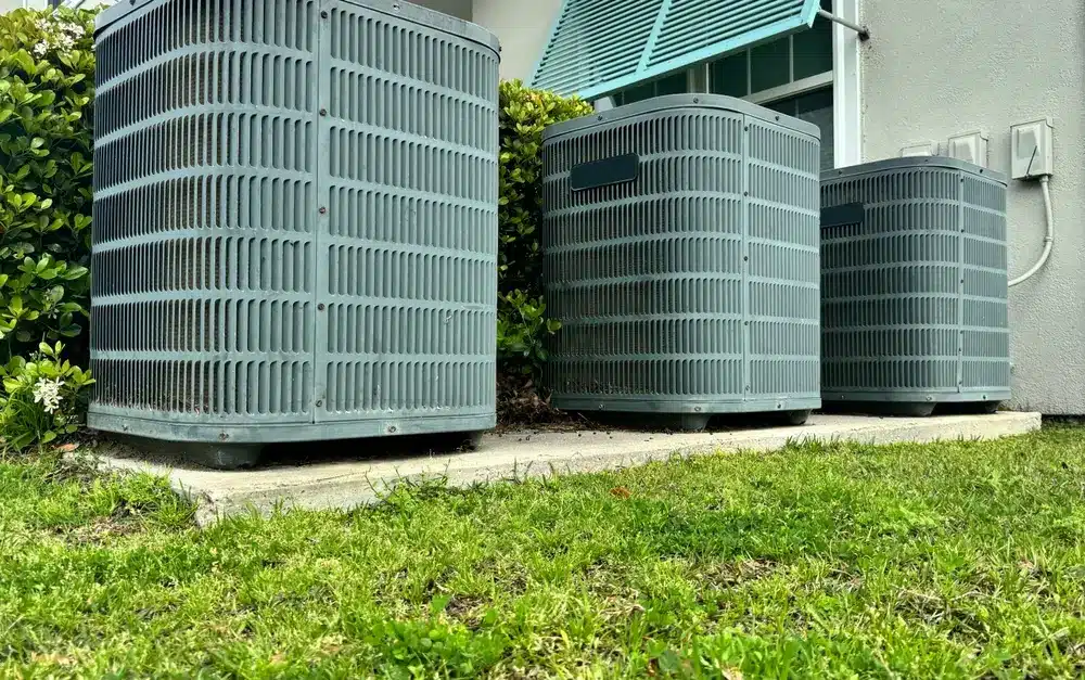 HVAC air conditioning unit installed on concrete slab with electrical box