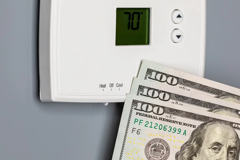 Thermostat for home furnace and air conditioner. Utility bill savings, energy cost